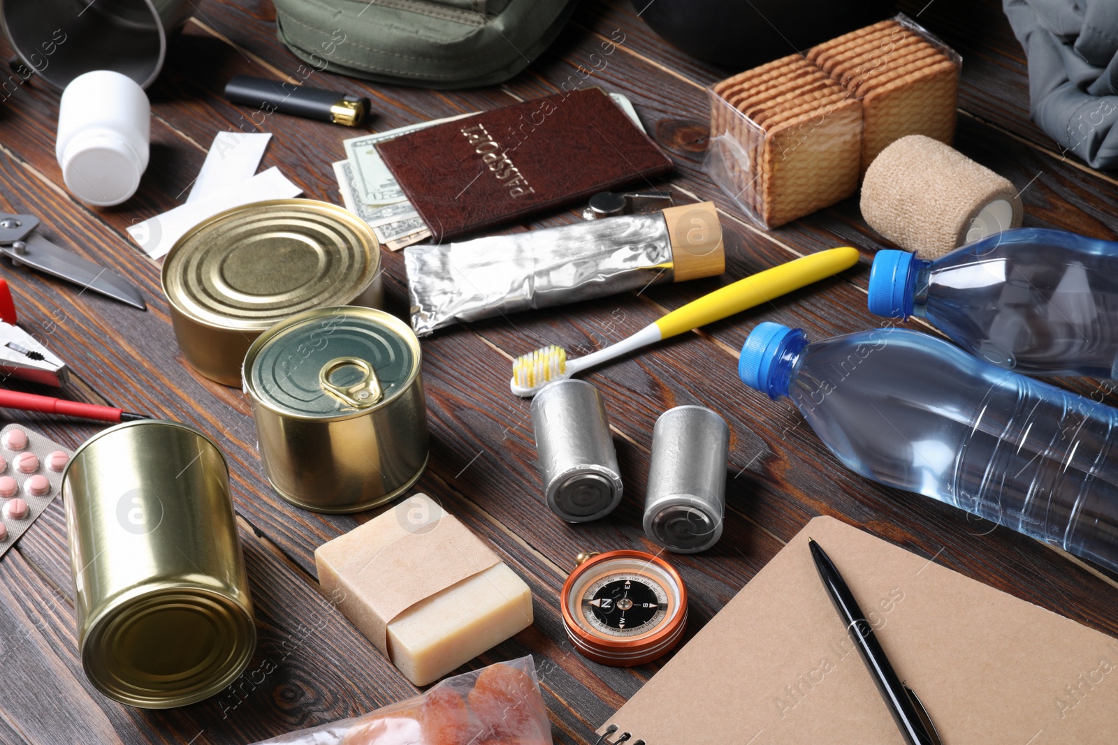 Photo of Disaster supply kit for earthquake on wooden table