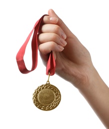 Photo of Woman holding gold medal with space for design on white background, closeup. Victory concept