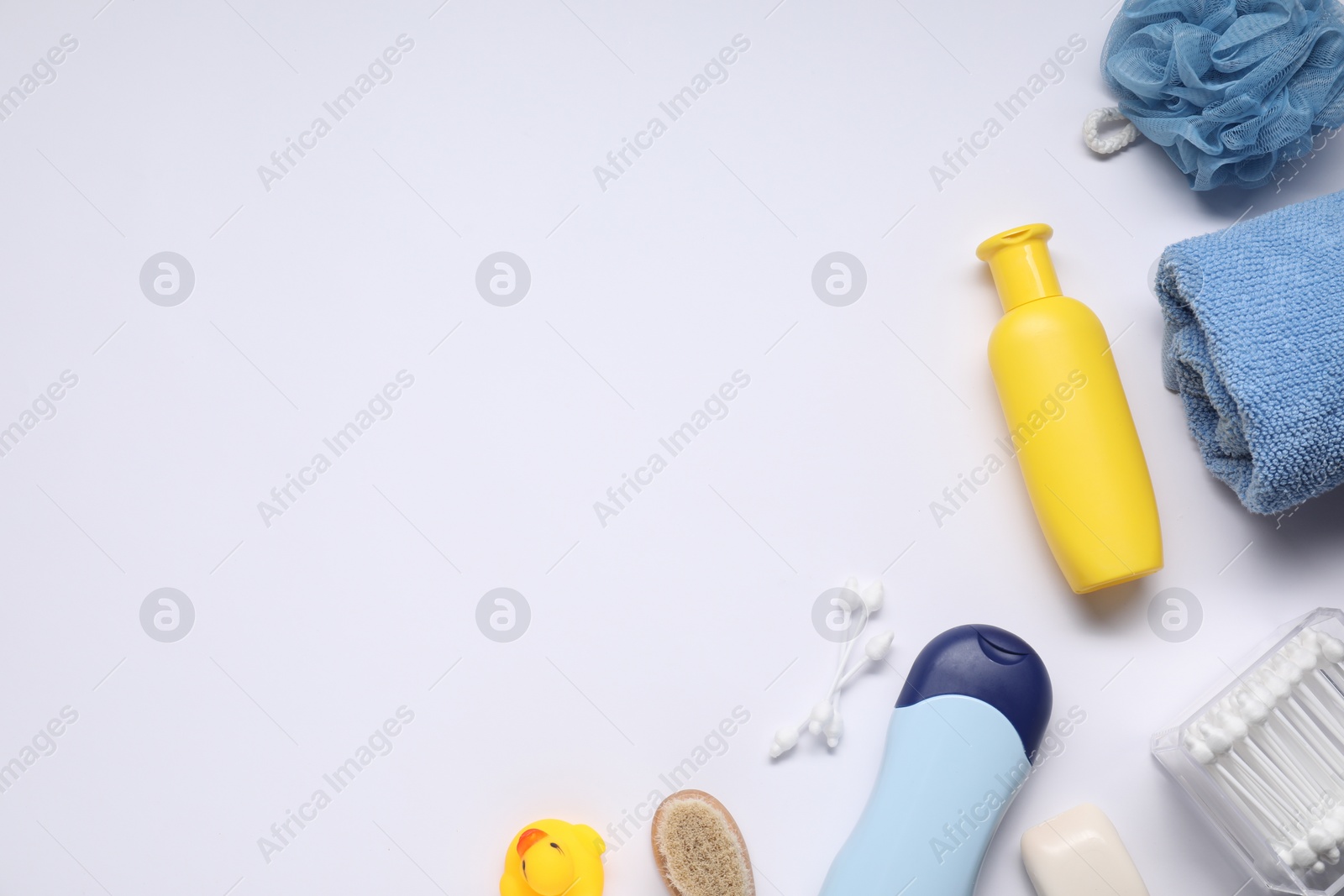 Photo of Different baby bath accessories and cosmetic products on white background, flat lay. Space for text