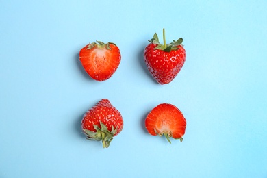 Photo of Flat lay composition with with tasty ripe strawberries on color background