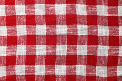 Red checkered tablecloth as background, top view