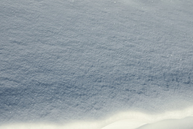 Photo of Beautiful snowdrift as background, closeup view. Winter weather