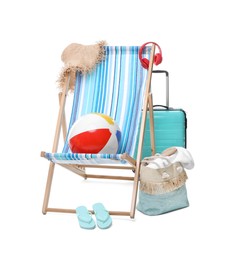 Photo of Deck chair, suitcase and beach accessories isolated on white