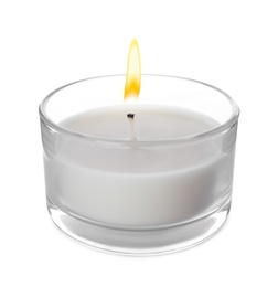 Photo of Small wax candle in glass holder isolated on white