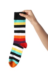 Photo of Woman holding colorful sock on white background