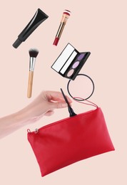 Image of Makeup products. Woman taking eyeliner from cosmetic bag on beige background, closeup