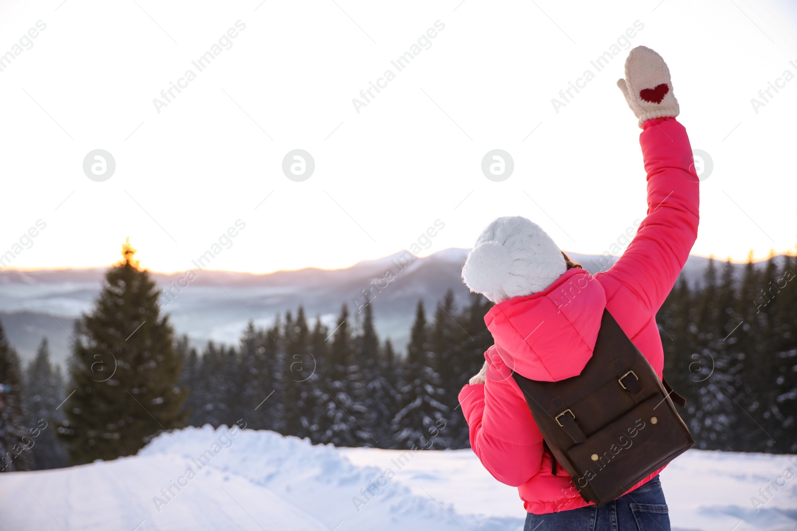 Photo of Young woman outdoors, space for text. Winter vacation