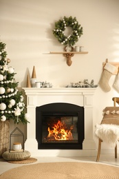 Modern fireplace in living room decorated for Christmas