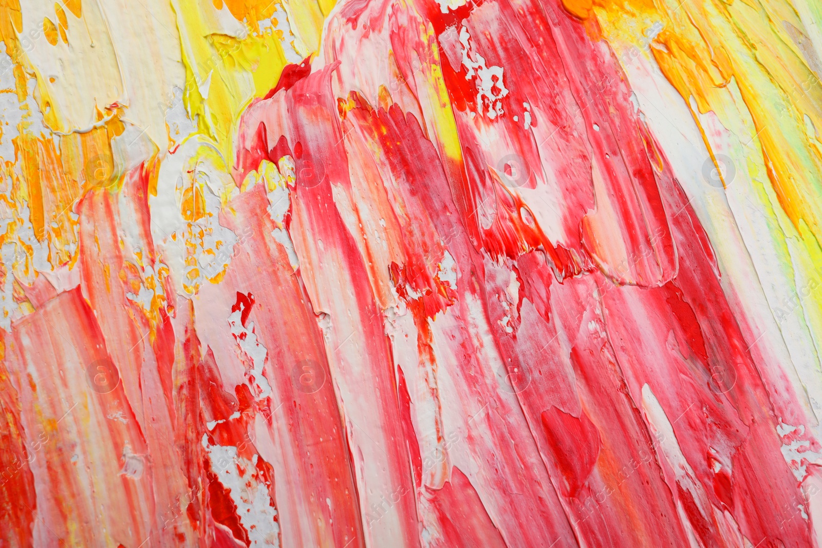 Photo of Beautiful strokes of colorful oil paints as background, closeup