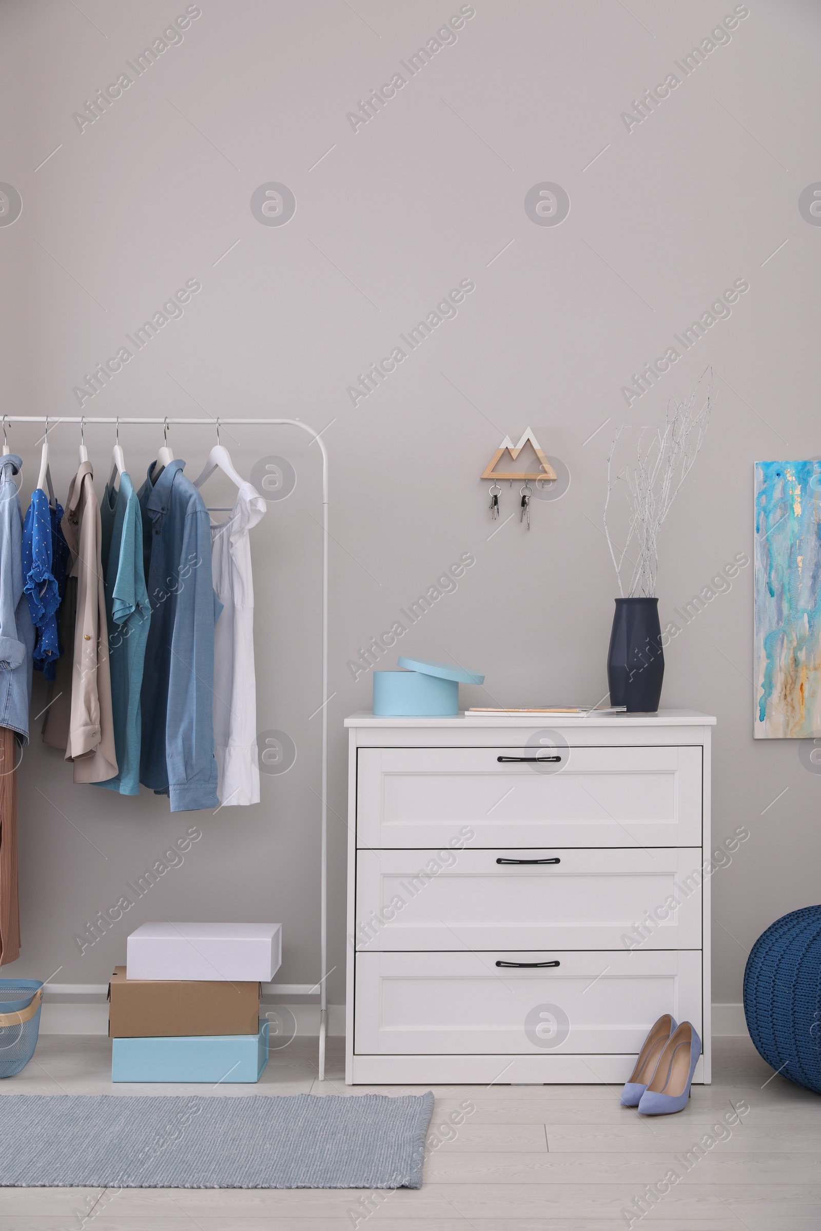 Photo of Modern hallway interior with stylish furniture and key holder