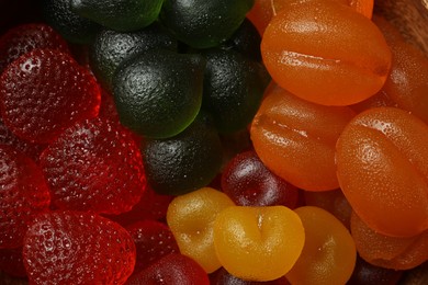 Photo of Delicious gummy fruit shaped candies as background, closeup