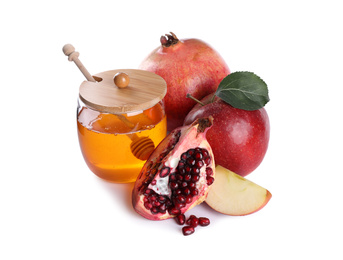 Photo of Honey, apples and pomegranates on white background. Rosh Hashanah holiday