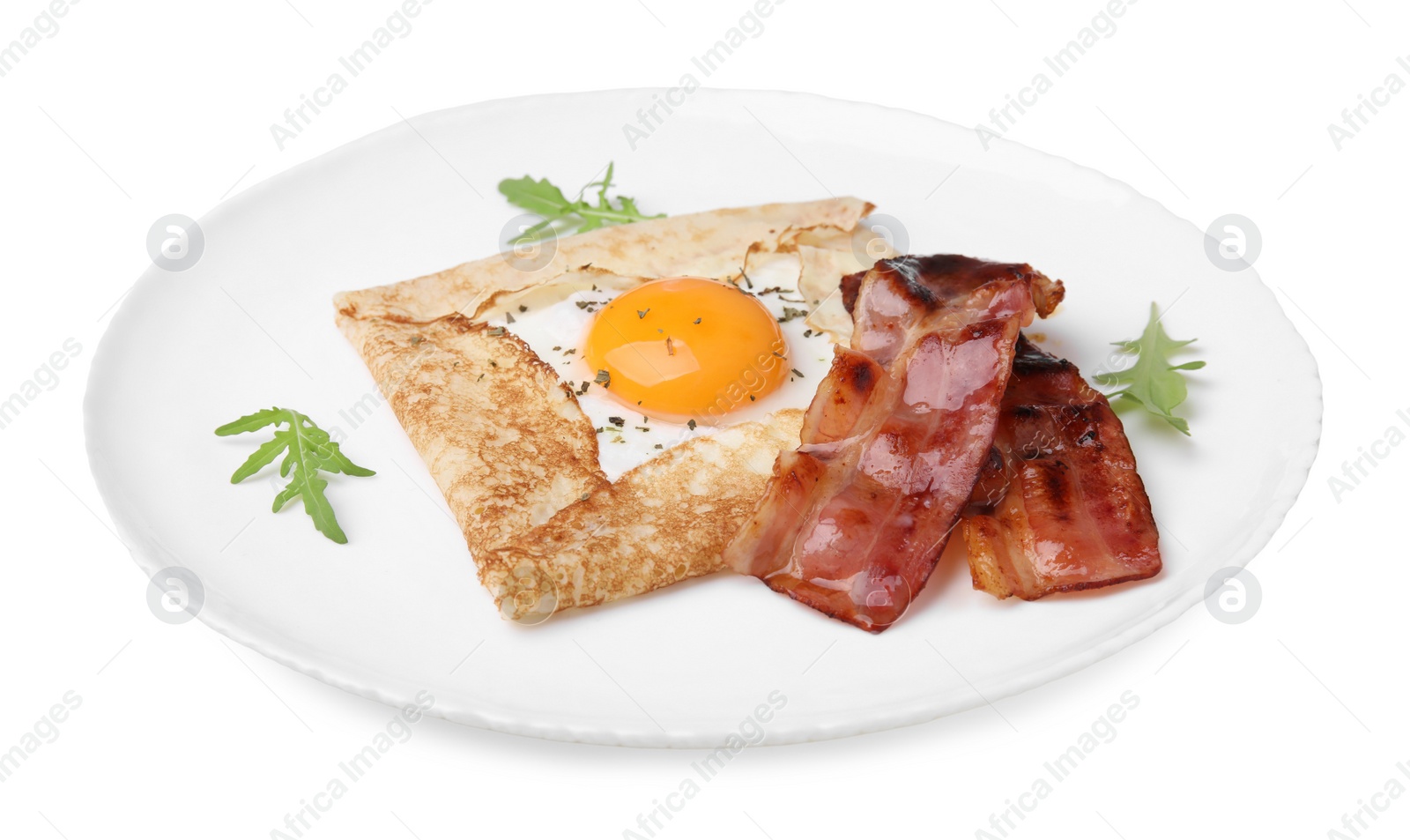 Photo of Delicious crepe with egg isolated on white. Breton galette