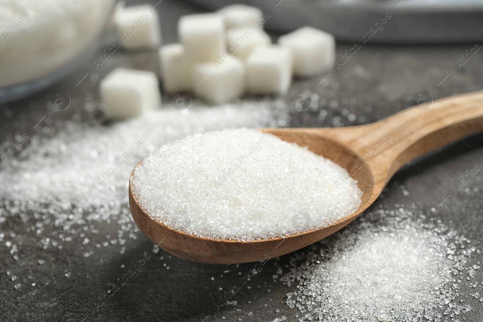 Photo of Composition with granulated sugar on grey table