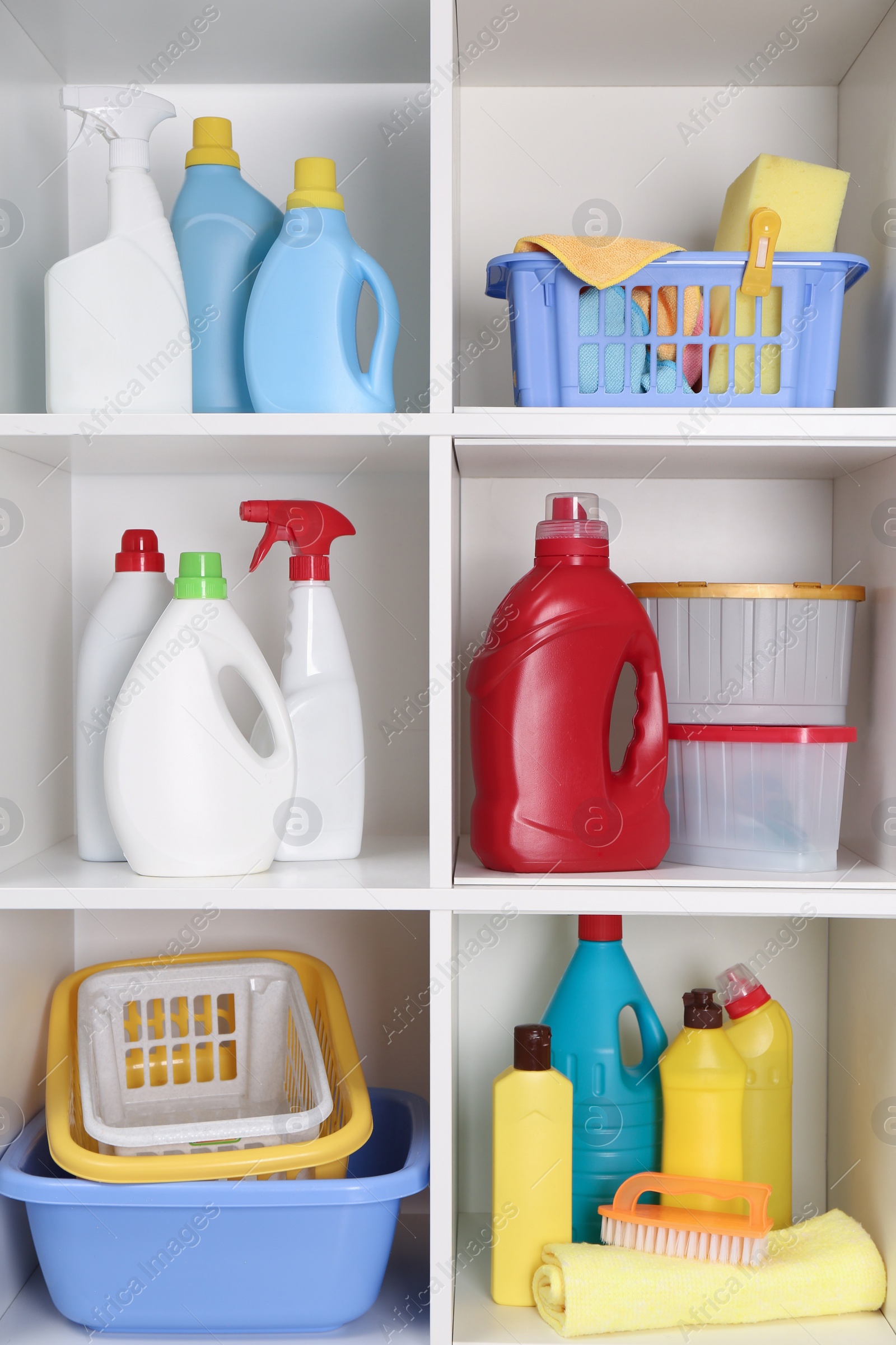 Photo of Different cleaning supplies and tools on shelves