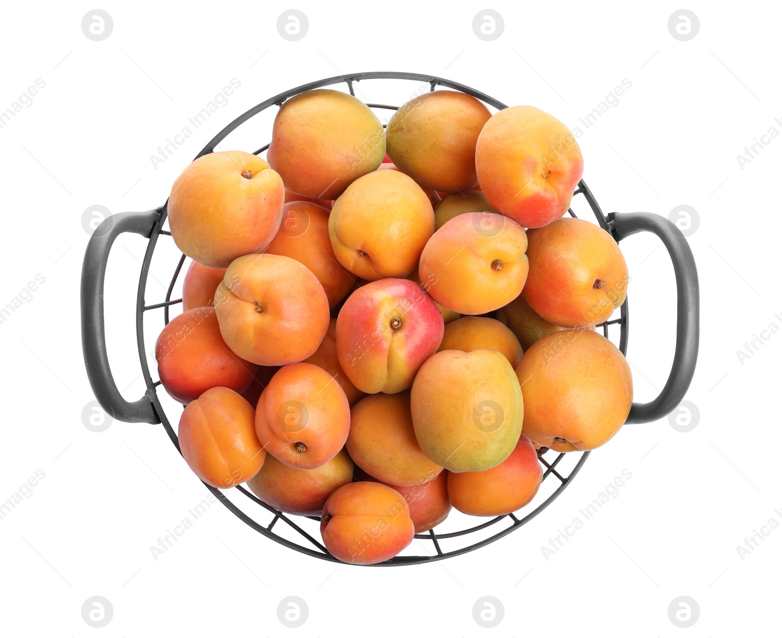 Photo of Delicious ripe apricots in metal basket isolated on white, top view