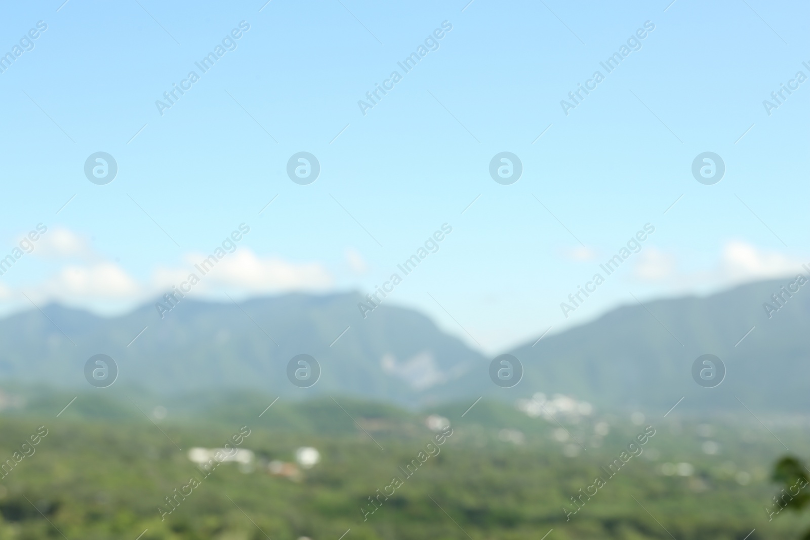 Photo of Blurred view of high mountains on sunny day