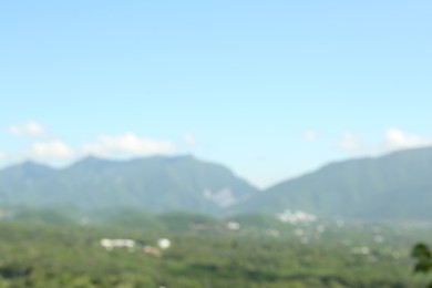 Blurred view of high mountains on sunny day