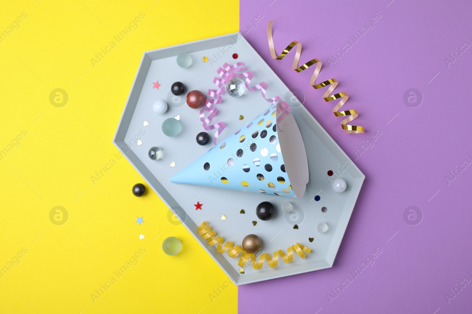 Photo of Flat lay composition with party accessories on color background