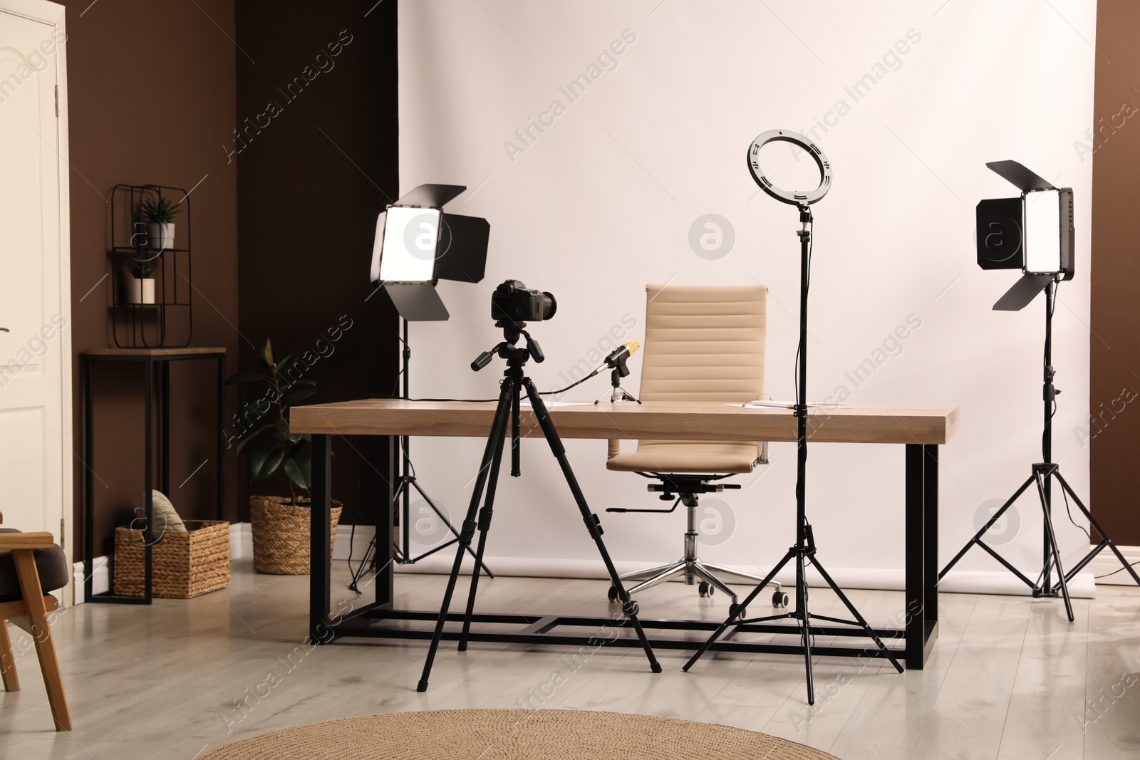 Photo of Modern blogger's workplace with professional equipment in room