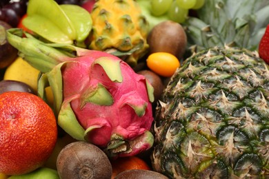 Photo of Assortment of fresh exotic fruits as background, closeup