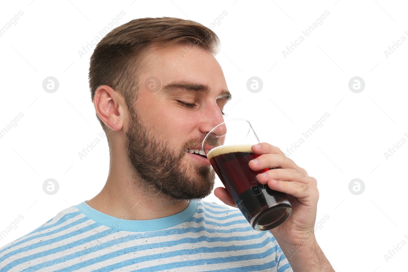 Photo of Handsome man with cold kvass on white background. Traditional Russian summer drink