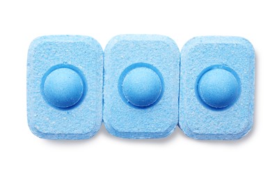 Water softener tablets on white background, top view