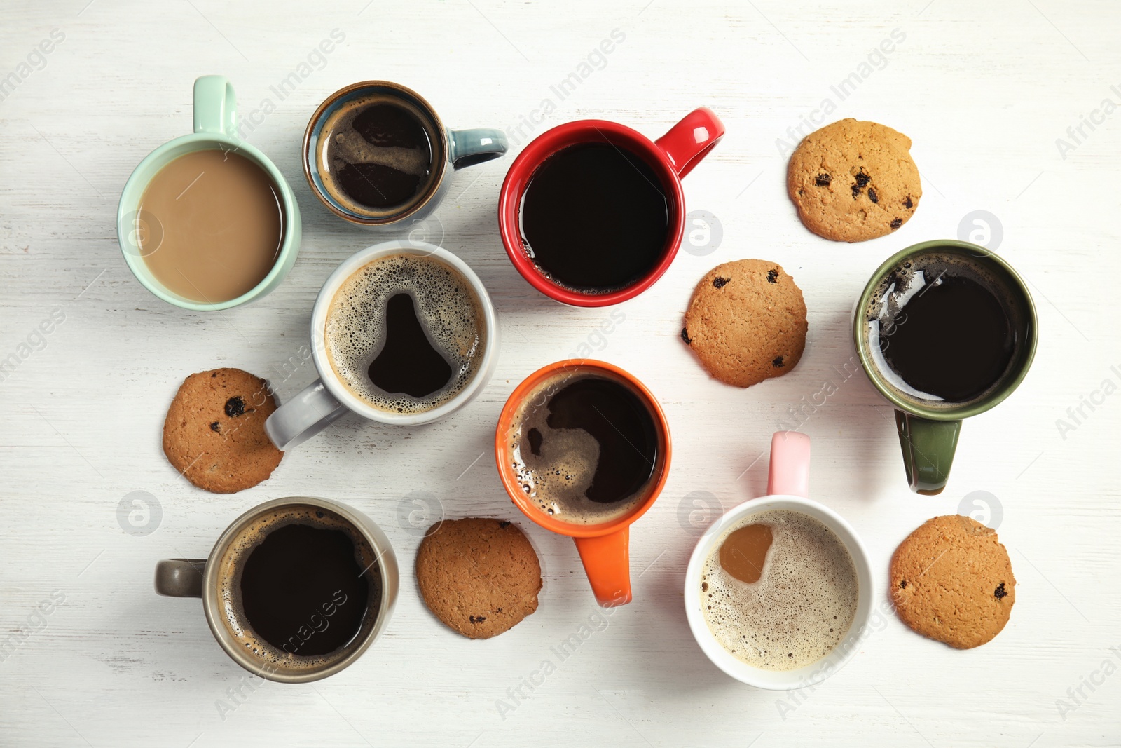 Photo of Flat lay composition with cups of coffee on light background. Food photography