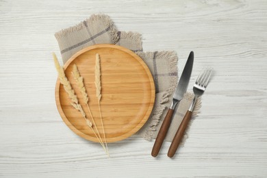 Photo of Stylish setting with elegant cutlery on white wooden table, top view