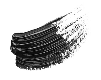 Photo of Brushstrokes of black oil paint on white background, top view