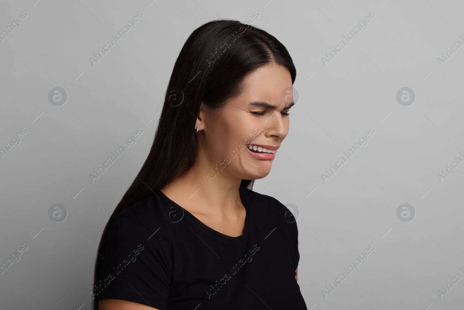 Photo of Personality concept. Emotional woman on grey background