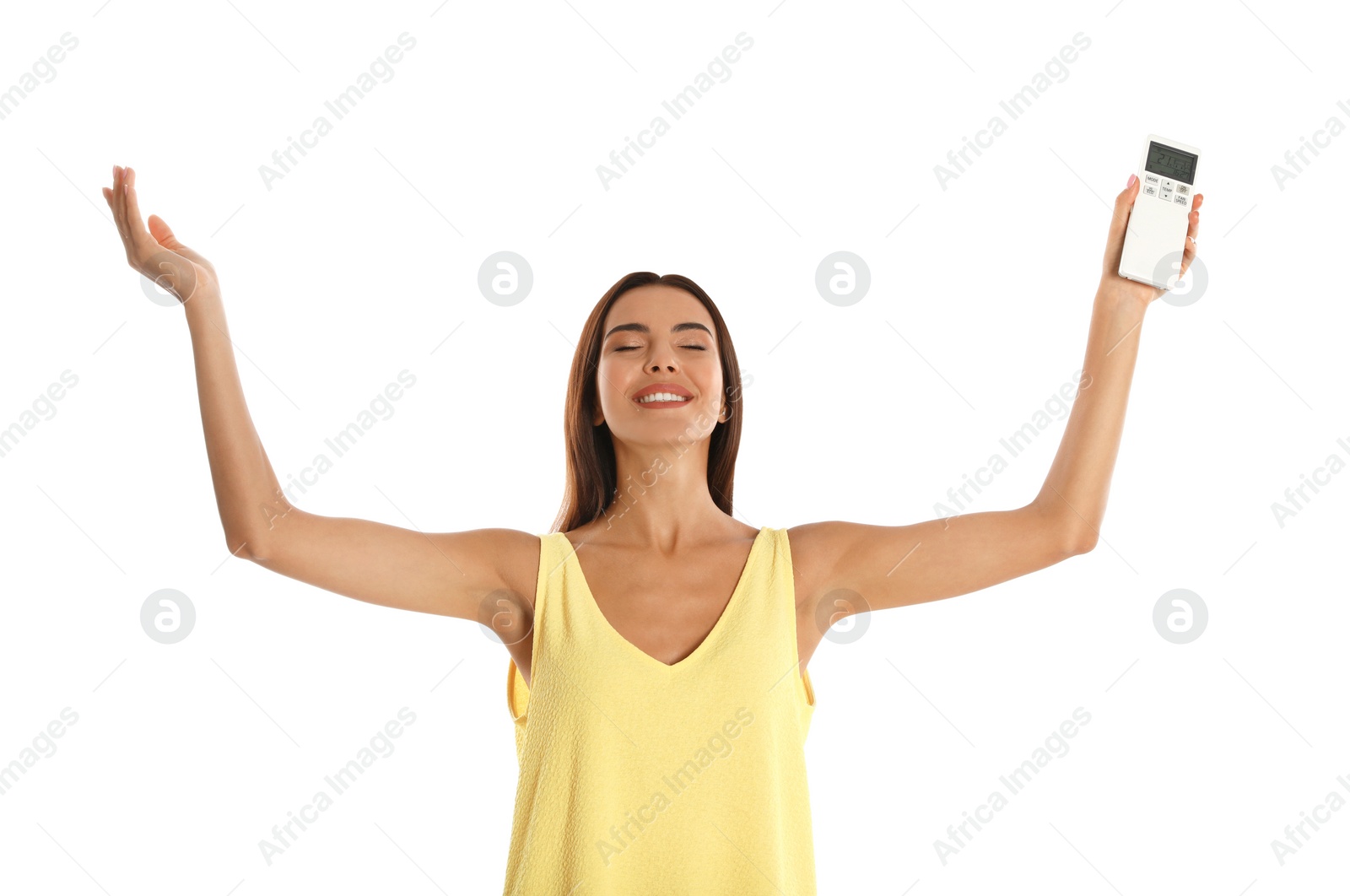 Photo of Young woman with air conditioner remote on white background