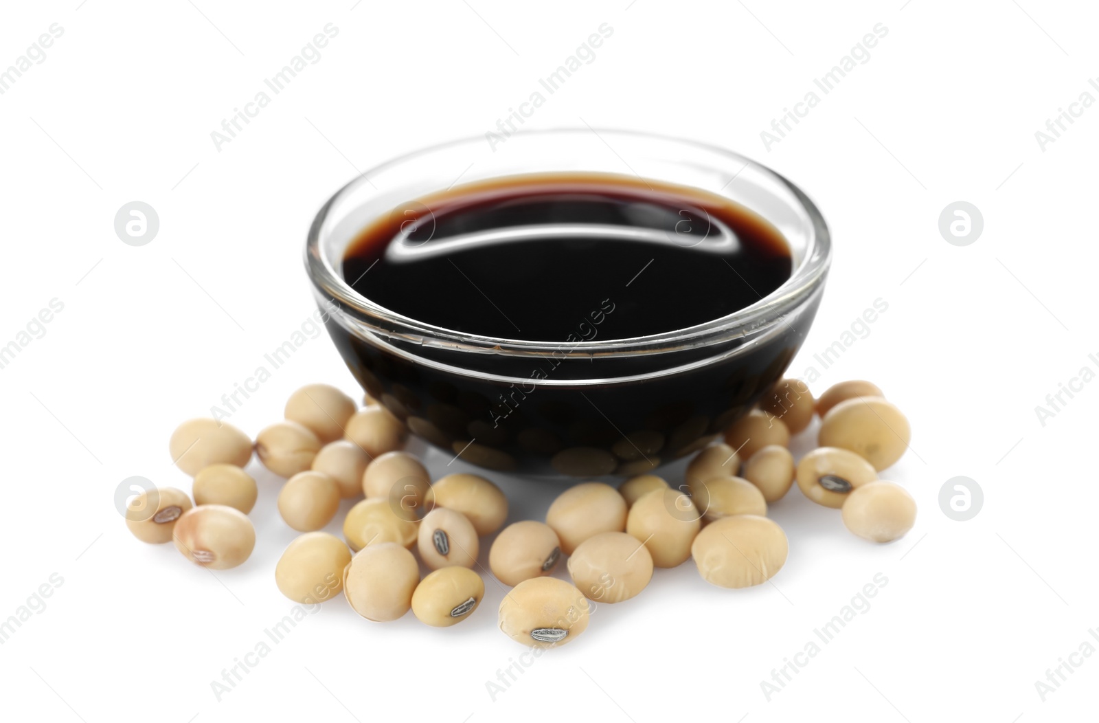 Photo of Bowl of tasty soy sauce and beans isolated on white