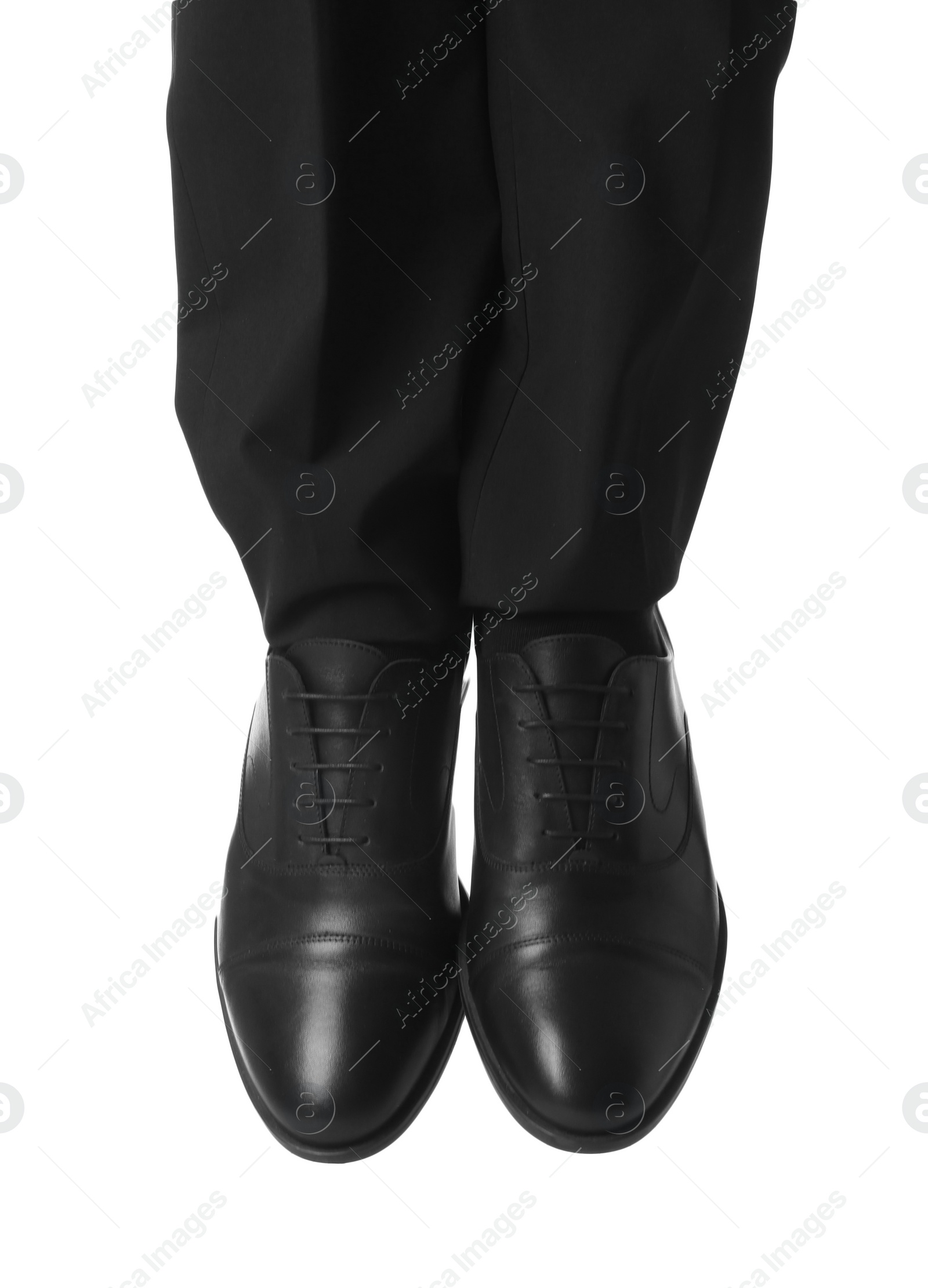 Photo of Businessman in leather shoes on white background, closeup