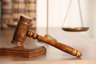 Photo of Law concept. Gavel on wooden table, closeup