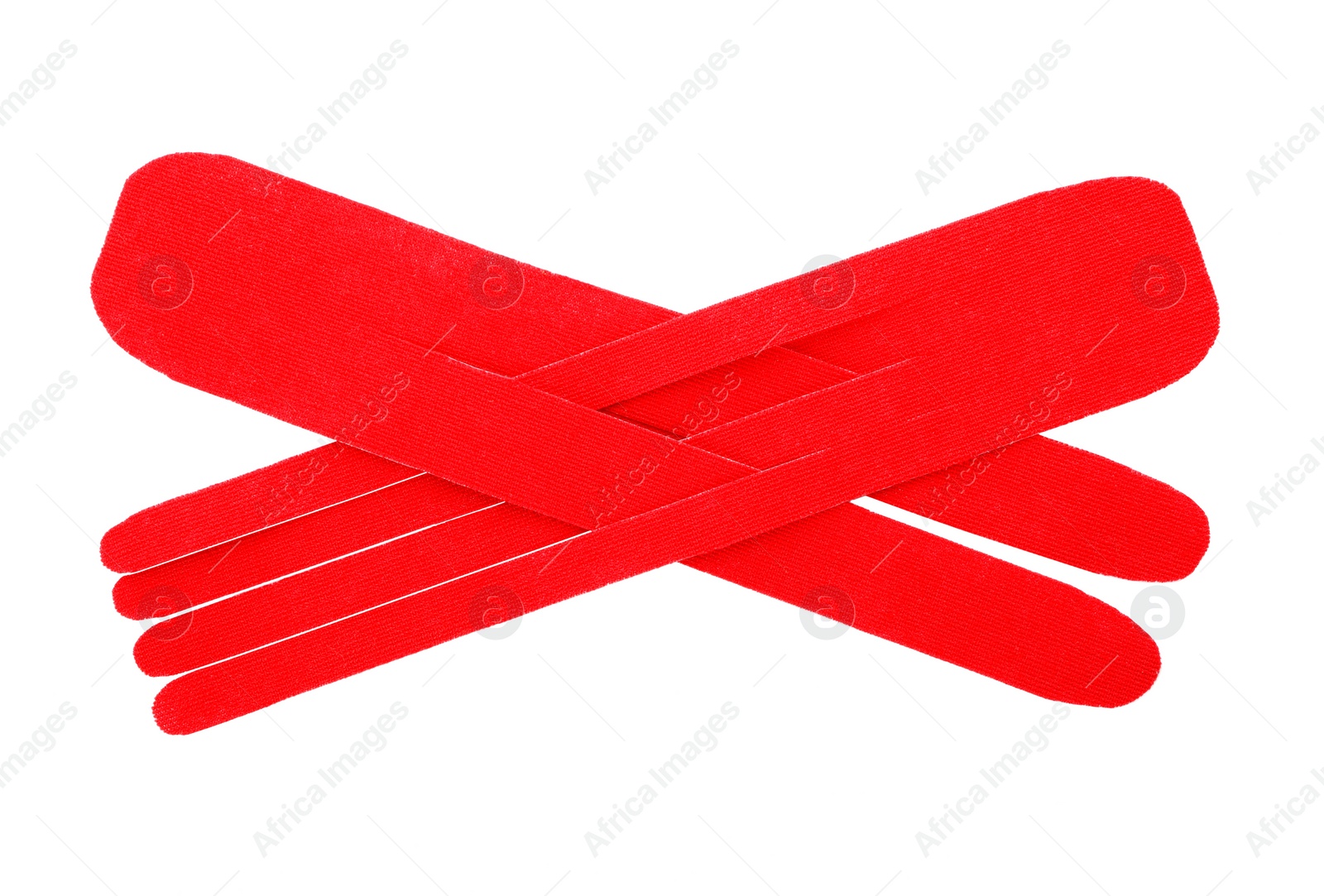 Photo of Red kinesio tape pieces on white background, top view