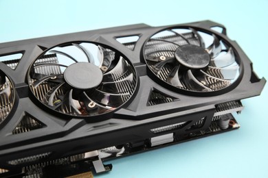 One graphics card on light blue background, closeup