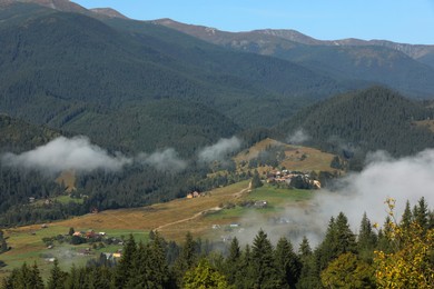 Picturesque view of mountains covered with fog