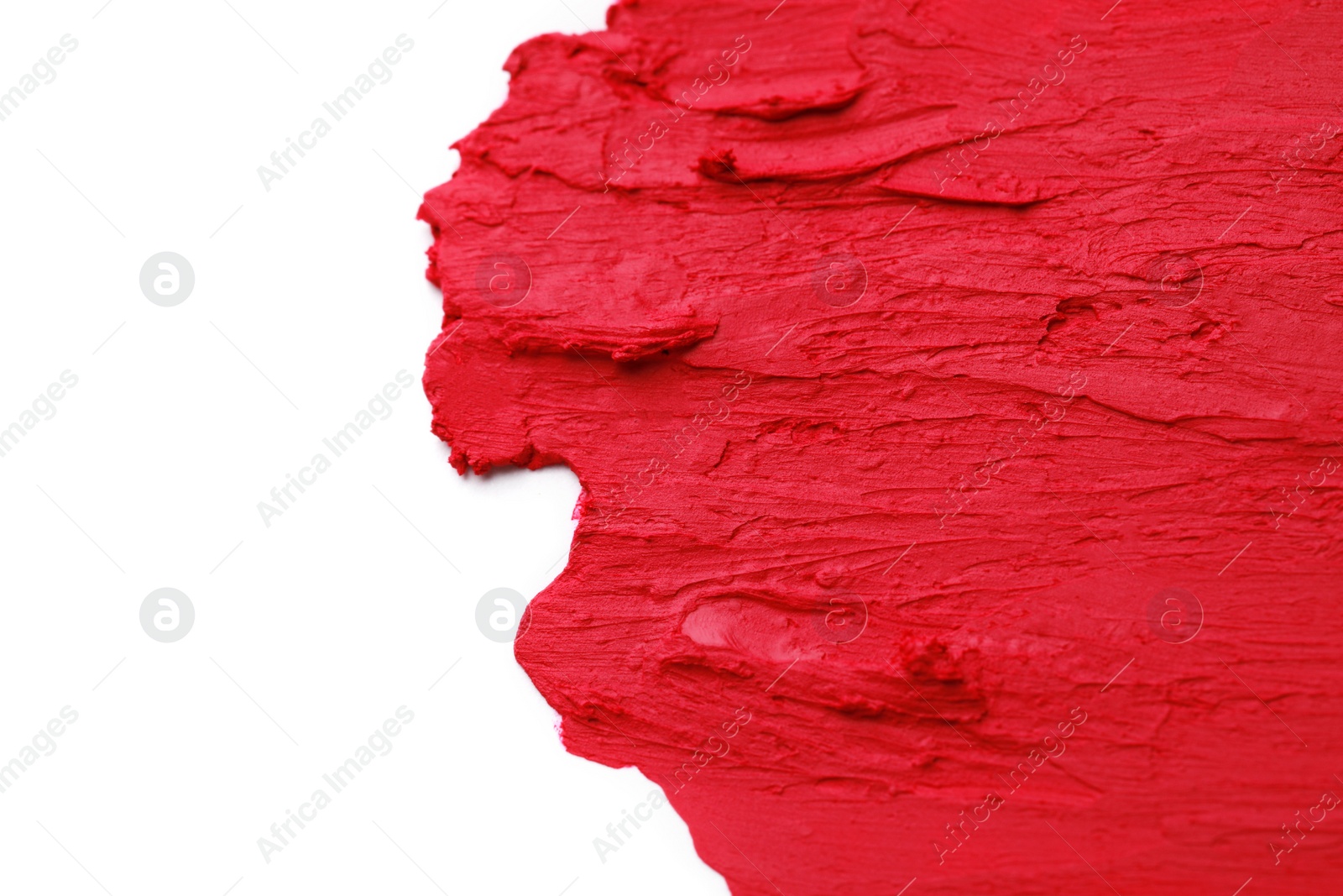 Photo of Smears of beautiful lipstick on white background