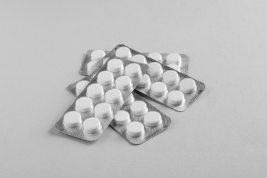 Photo of Blisters of pills on white background. Medicinal treatment