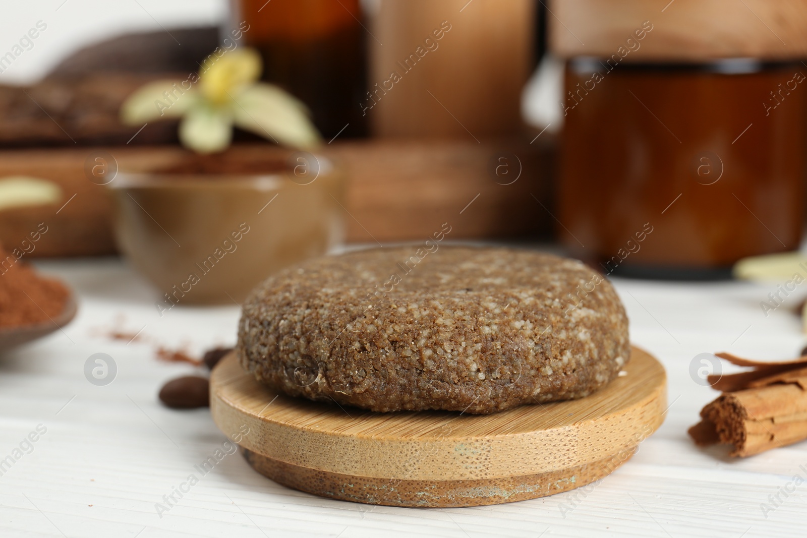 Photo of Homemade cosmetic product on white wooden table, closeup