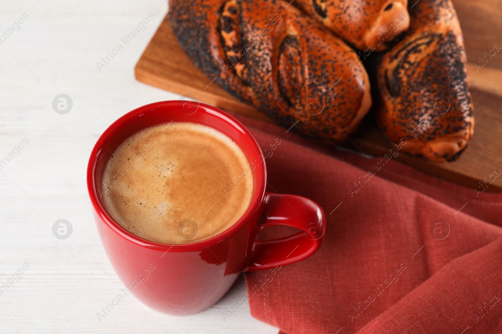 Photo of Delicious coffee and pastries on white wooden table