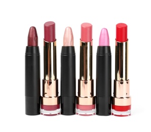 Photo of Set of colorful lipsticks isolated on white