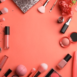 Photo of Flat lay composition with beauty accessories and space for text on coral background