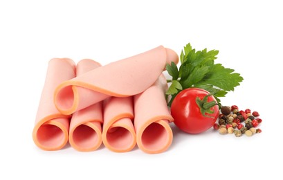Photo of Slices of delicious boiled sausage with parsley, tomato and pepper on white background