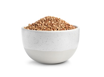 Bowl with uncooked buckwheat on white background