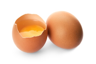 Raw brown chicken eggs on white background