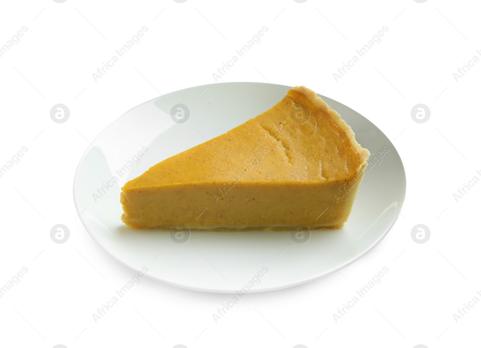 Photo of Plate with piece of delicious pumpkin pie isolated on white