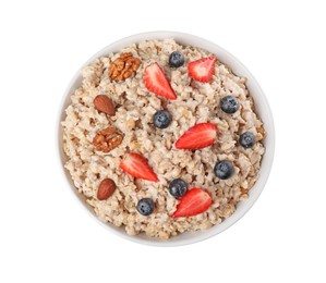 Photo of Tasty boiled oatmeal with berries and nuts in bowl isolated on white, top view