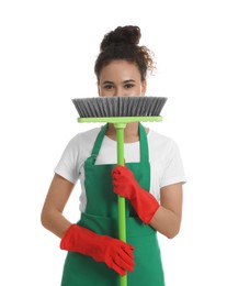African American woman with green broom on white background